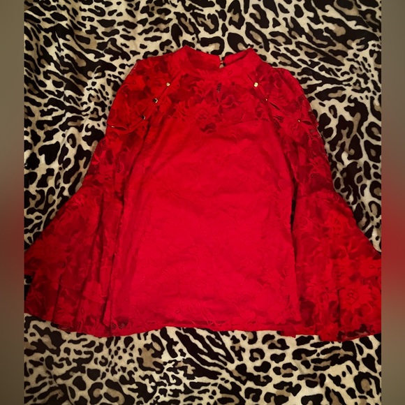 Bracelet-length bell sleeves top with lace and peek-a boo shoulders. - Picture 3 of 5